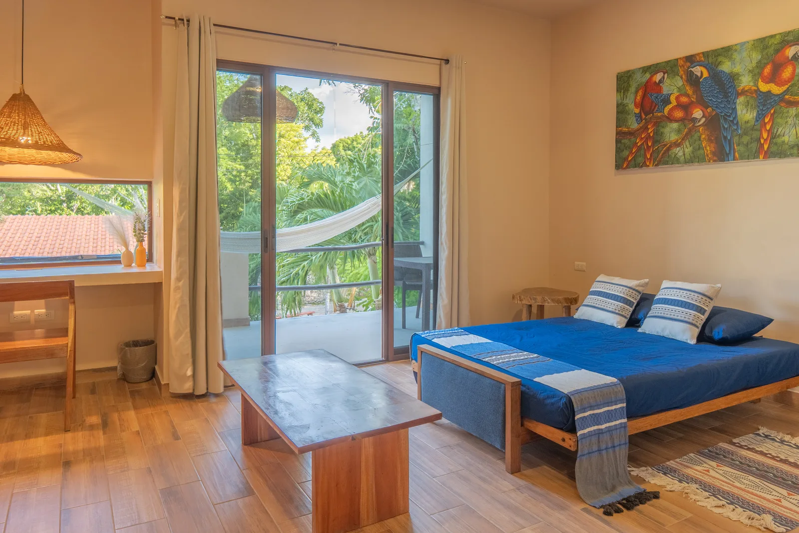 Apartment bedroom with balcony and hammock