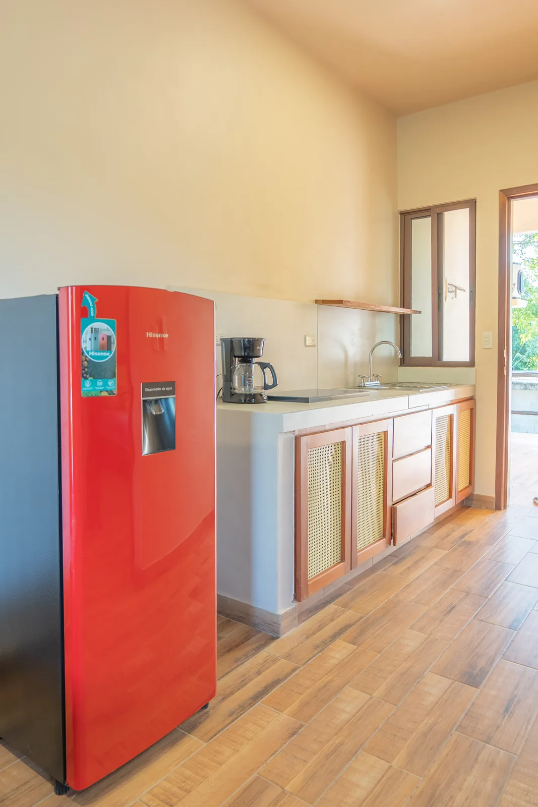Apartment kitchen with red fridge