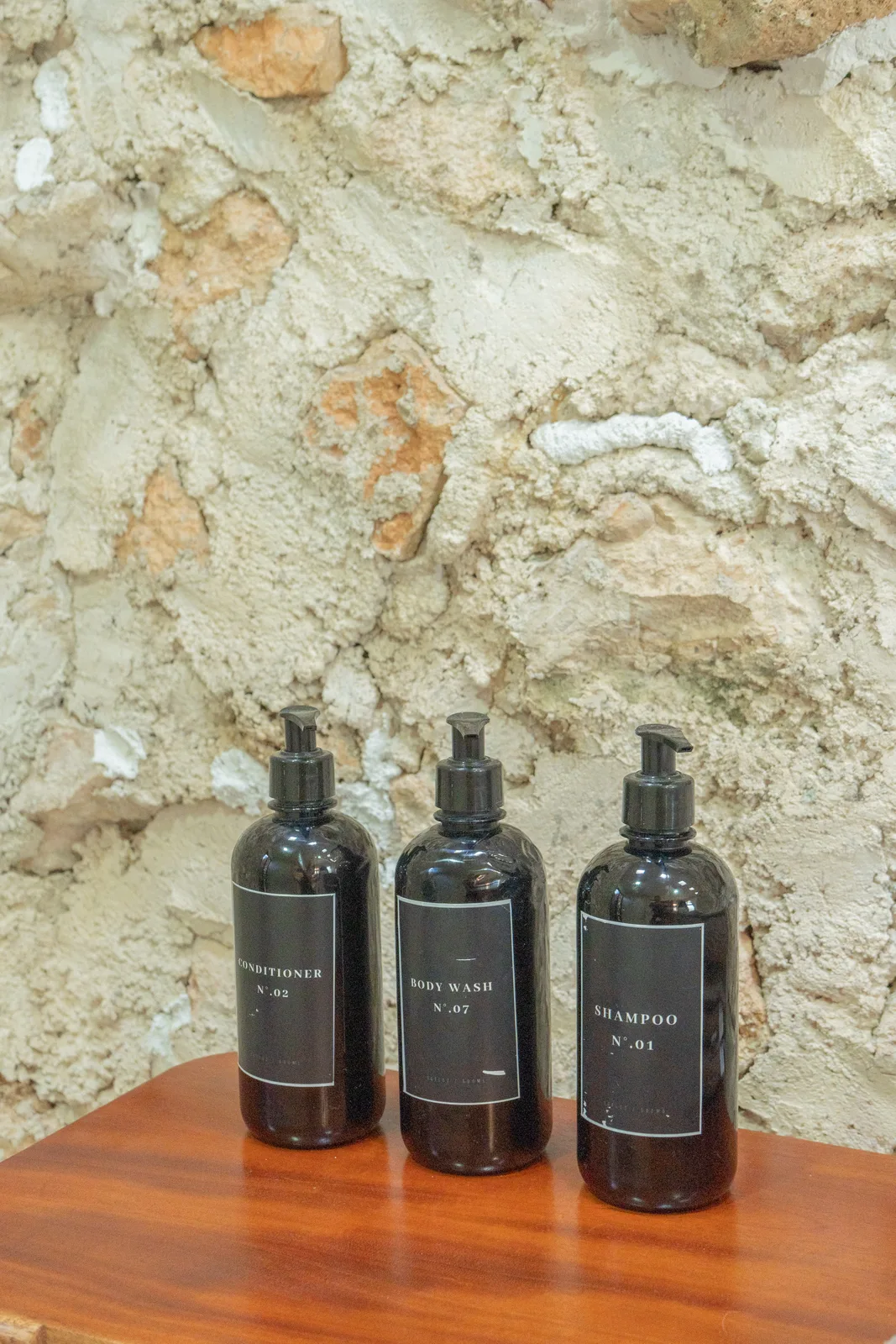 Bathroom amenities on stone wall