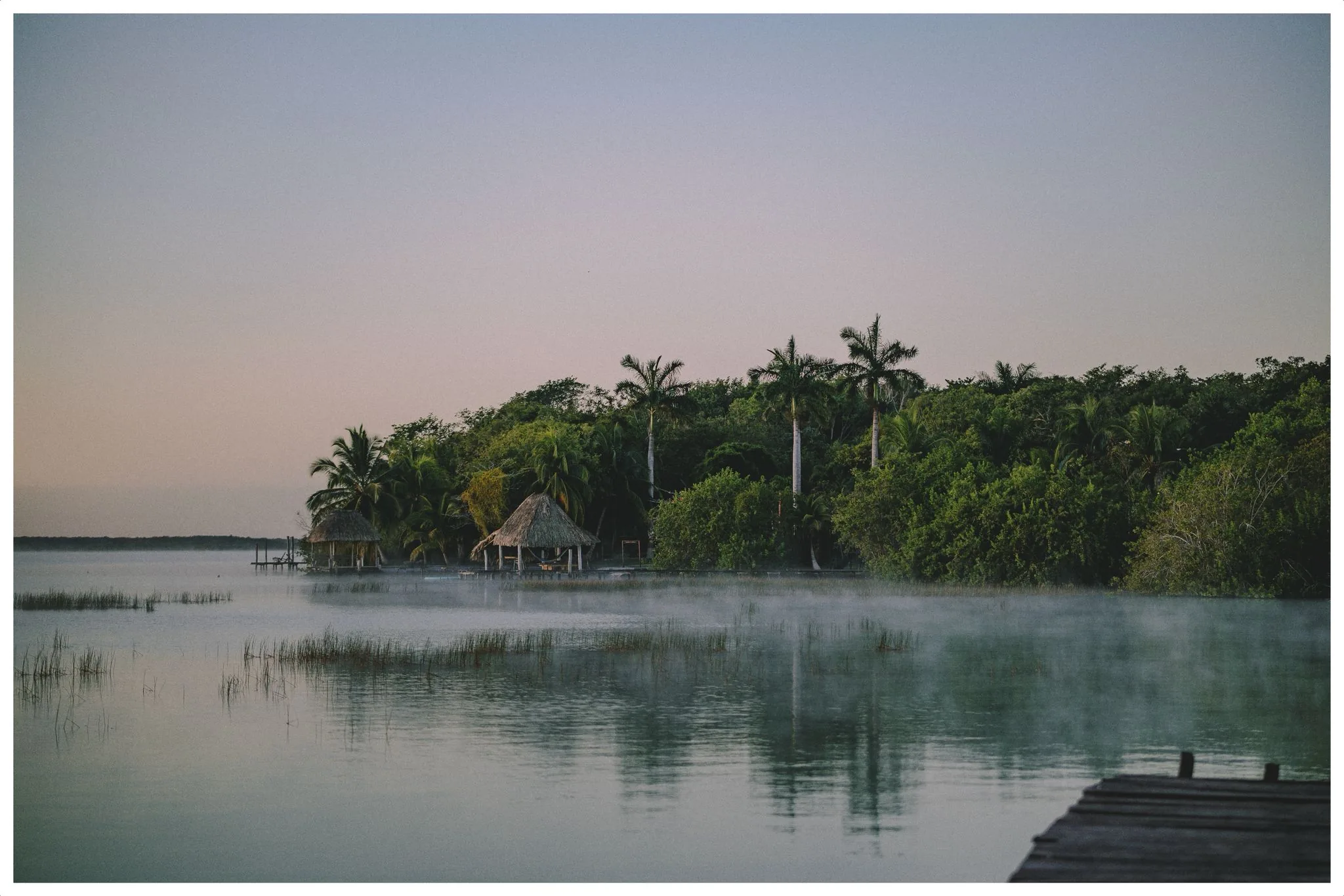 Laguna de Bacalar at dawn, mist over the water