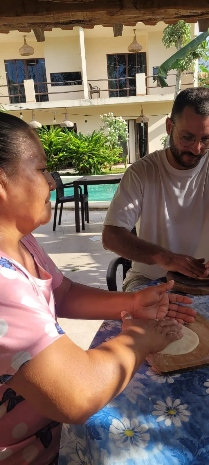 Tortilla workshop with Mari, pressing masa by the pool